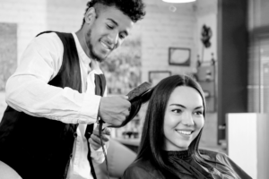 cosmetologist doing a woman's hair