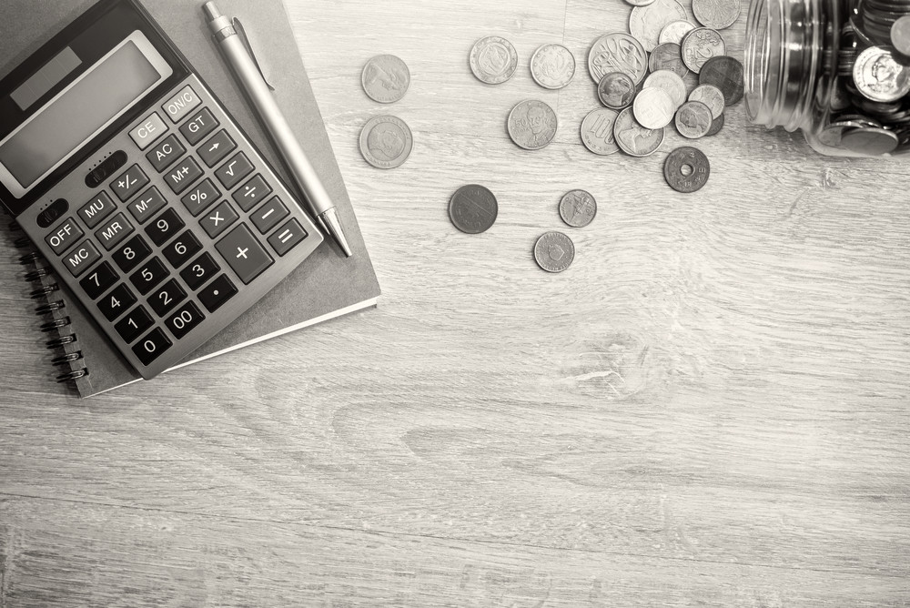 money and calculator on desk 