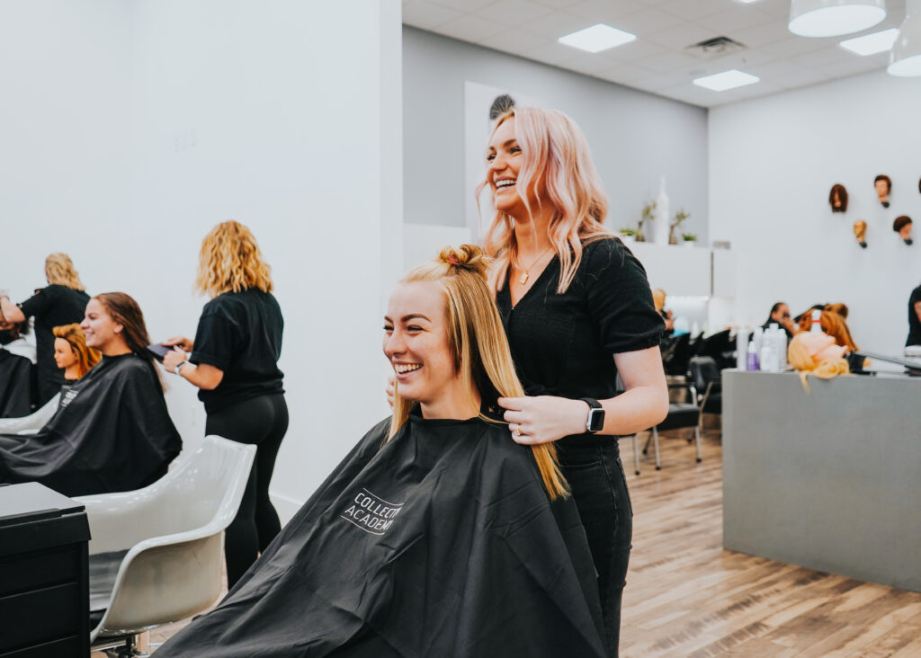 A stylist smiling with her client