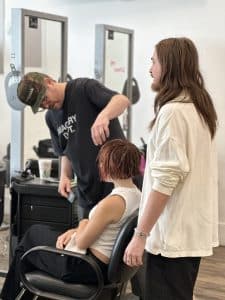 Working on styling someone's hair